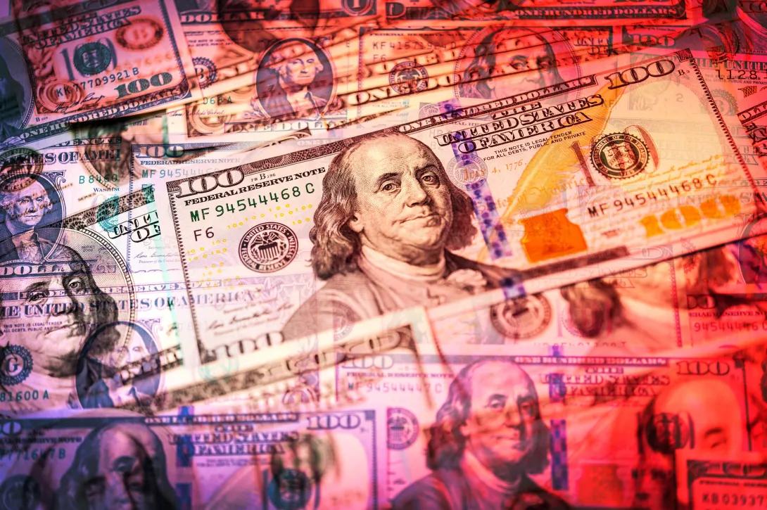 Close-up view of cash money american dollars bills background with Benjamin Franklin portrait. Finance and business concept. Close-up. Shallow depth of field. Double exposure.